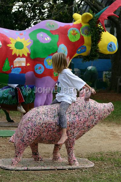 IMG_JE.ART01.JPG - Kid playing on the Hogge statues outside the Museum of Bermuda Art in the Botanical Gardens, Bermuda