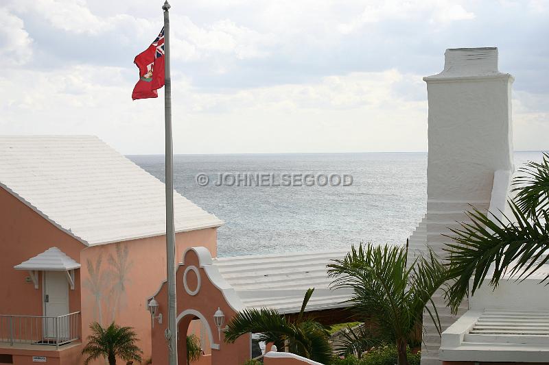 IMG_JE.R04.JPG - Roofline and flag at the Reefs, South Shore, Bermuda