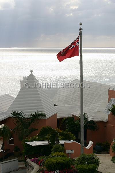 IMG_JE.R06.JPG - Roofline and flag at the Reefs, South Shore, Bermuda